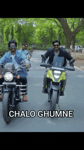 a group of men are riding motorcycles down a road with the words chalo ghumne below them