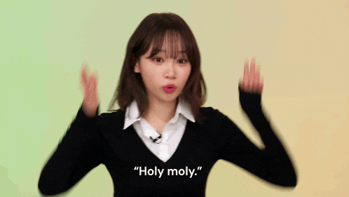 a woman in a black sweater and white shirt says " looking like this "