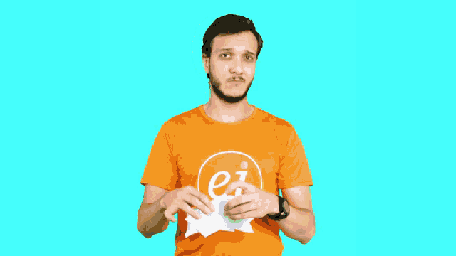 a man wearing an orange shirt that says ei