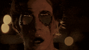 a close up of a person 's face with a hole in it