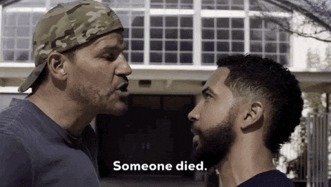 two men are looking at each other and one of them is saying " someone died "