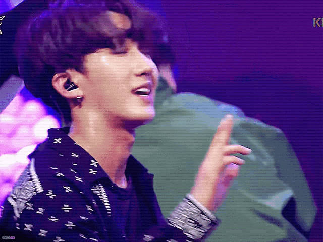a close up of a person 's face with a purple background that says ki on it