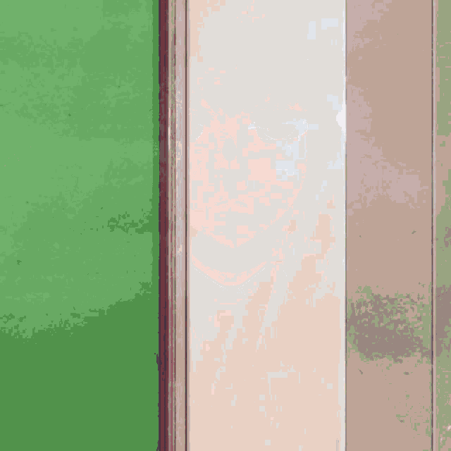 a green wall with a white wall and a gray wall