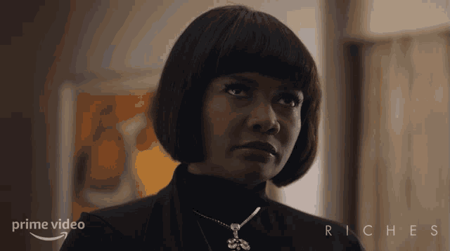 a woman wearing a black turtleneck and a necklace is featured in a prime video advertisement for riches