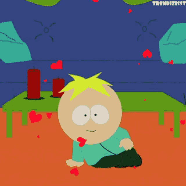 a cartoon character from south park sits on the floor in front of a table