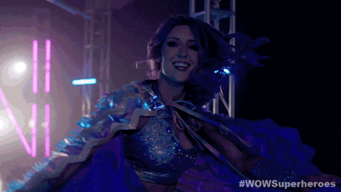 a woman in a superhero costume with the hashtag wowsuperheroes on the bottom
