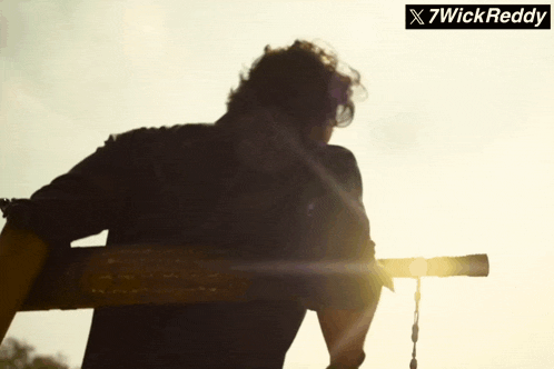 a silhouette of a man with a sign that says x7wick reddy on it