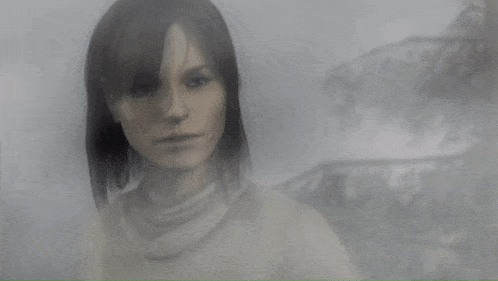 a black and white photo of a woman in a foggy area