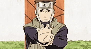 a man in a helmet is holding his hands out in front of a wooden wall .