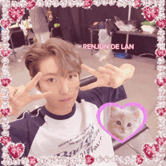 a picture of renjun de lan with a cat in a heart frame