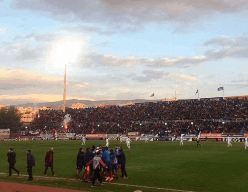 a soccer field with a banner that says erosi