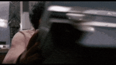 a close up of a person 's back with a blurred image