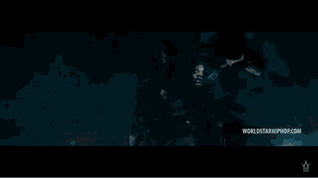 a person is sitting in a chair with a worldstarhiphop.com logo on the bottom