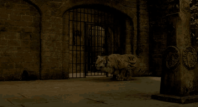 a tiger standing in front of a brick building with bars