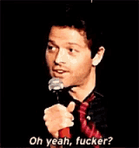 a man speaking into a microphone with the words oh yeah fucker written below him