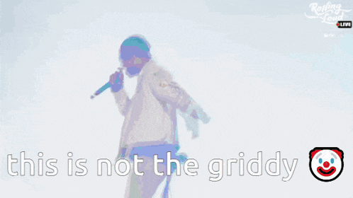 a man standing in front of a blue sky with the words " this is not the griddy "