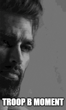 a black and white photo of a man with a beard and the words `` troop b moment '' written on it .