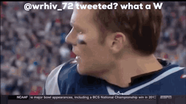 a close up of a football player 's face with the caption " what a w " .