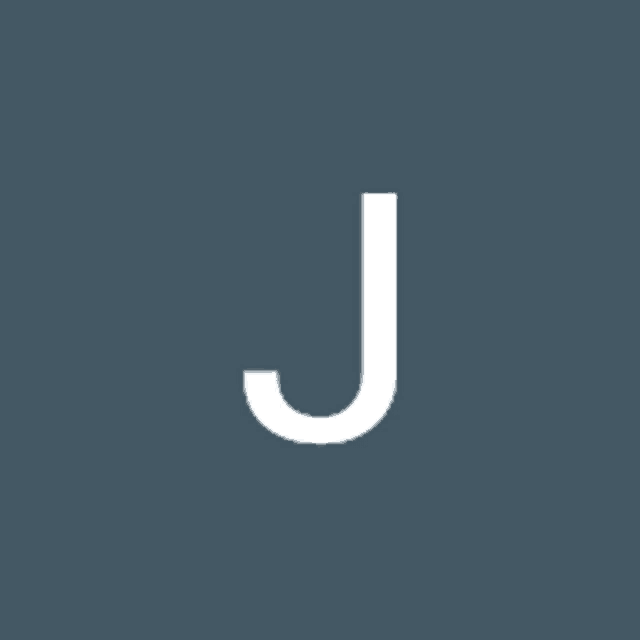 a white letter j on a dark blue background .