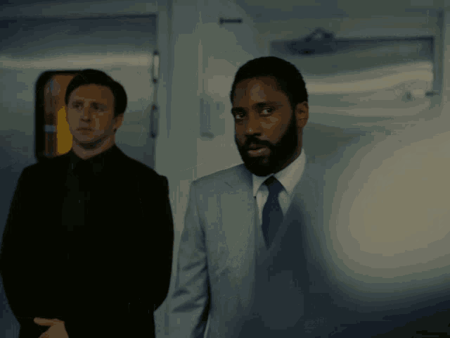 a man in a suit and tie says " i ordered my hot sauce an hour ago " in front of another man
