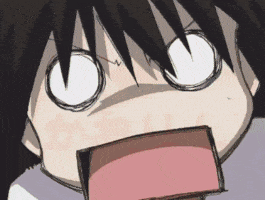 a close up of a person 's face with a surprised expression