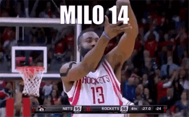 a basketball player with the number 13 on his jersey celebrates a basket
