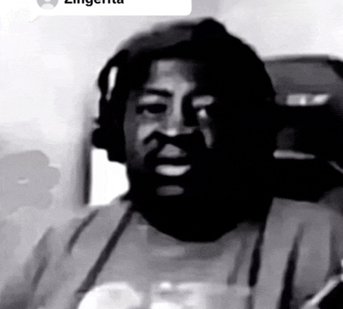 a black and white photo of a man with a beard and a speech bubble that says zingerta