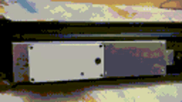 a pixelated image of a white box with a hole in it