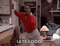 a man is dancing in a living room with the words `` lets goooo '' written on the screen .