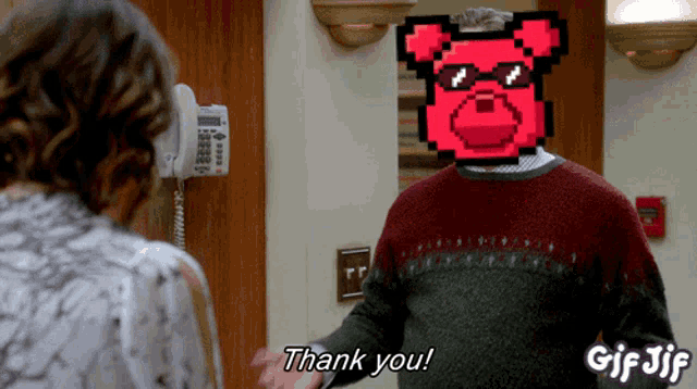 a gif of a man saying thank you with a red dog on his head