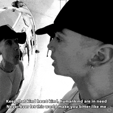 a man looking at himself in a mirror with the words " keep that kind heart kind "