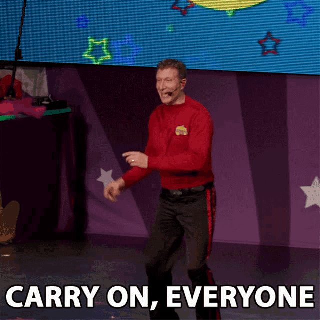 a man in a red sweater with the words carry on everyone on the bottom