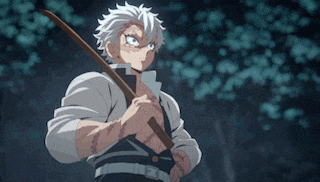 a man in a white shirt is holding a sword in his hand .