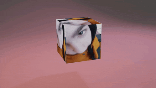 a cube that has a picture of a person on it