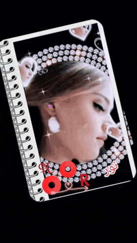 a spiral notebook with a picture of a woman with a crown on her head