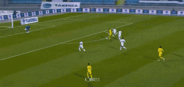 a soccer game is being played on a field sponsored by takenda and cardial