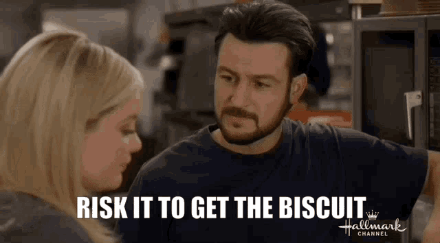 a man and a woman are talking in a kitchen and the man says risk it to get the biscuit