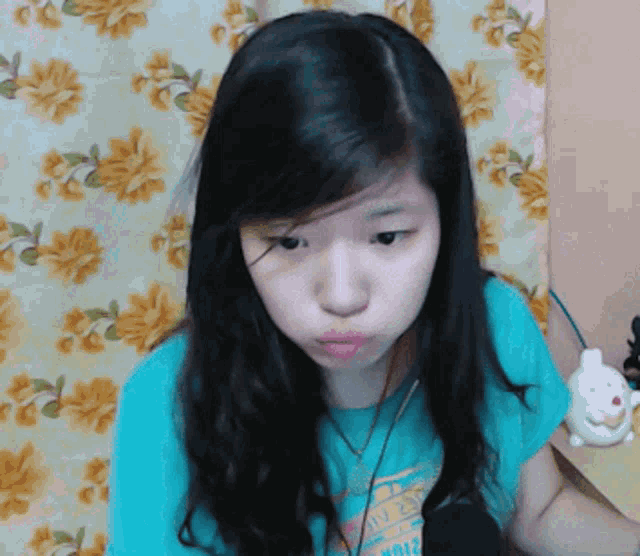 a girl wearing a t-shirt that says ' tokyo ' on it