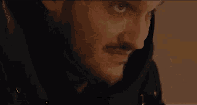 a close up of a man 's face with a caption that says nie kurwa
