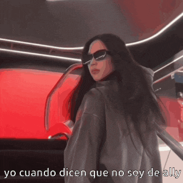 a woman wearing sunglasses is standing in front of a red car with the words yo cuando dicen que no soy de ally below her