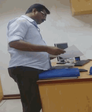Office Reading GIF - Office Reading Man GIFs