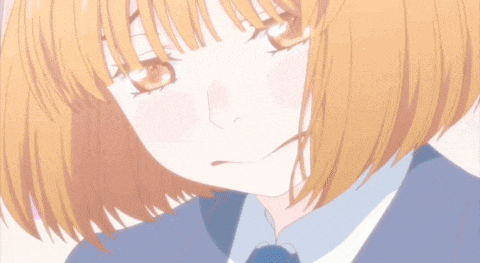 a close up of a girl with short hair and a blue tie