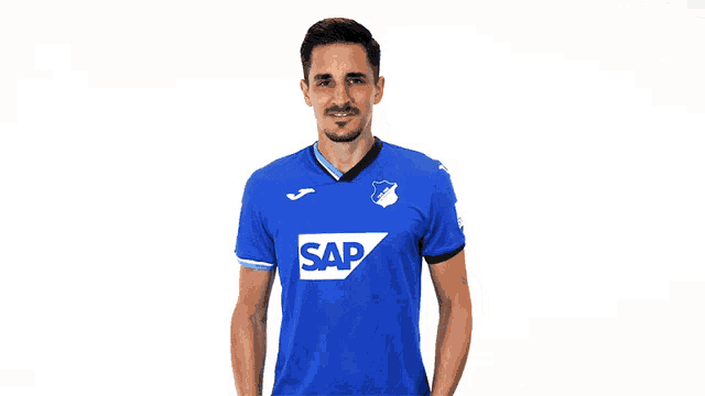 a man is wearing a blue shirt with the word sap on it