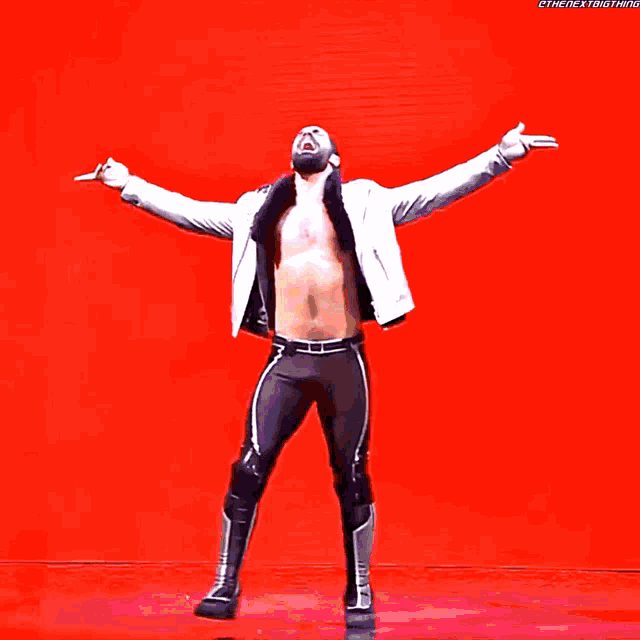 a wrestler with his arms outstretched and the hashtag thenextbigthing