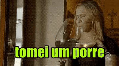a woman is drinking a glass of wine with the words tomei um porre above her
