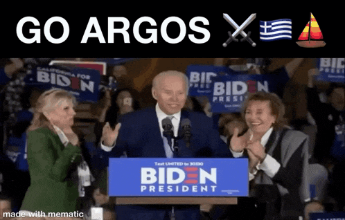 joe biden giving a speech in front of a crowd with a sign that says biden president