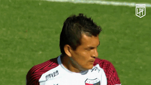 a man wearing a soccer jersey that says lpfl on the front