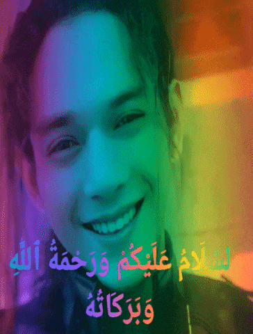 a picture of a smiling man with arabic writing on it