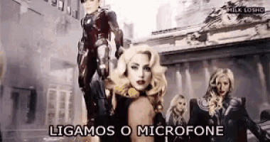 a group of women standing in front of a building with the words ligamos o microfone written on the bottom .