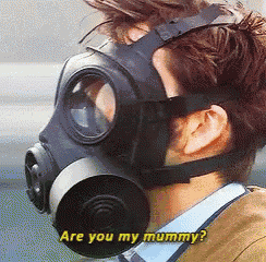 a man wearing a gas mask is asking if he is my mummy